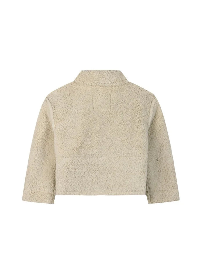 Πίσω όψη παιδικού μπουφάν fleece σε μπεζ χρώμα.
