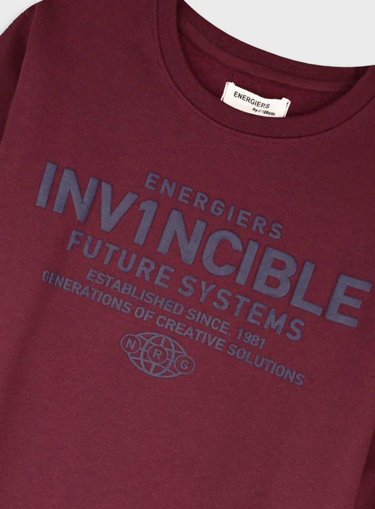 Energiers παιδικό σετ για αγόρι με μπεζ μπλούζα Invincible και μαύρο παντελόνι φόρμας