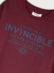 Energiers παιδικό σετ για αγόρι με μπεζ μπλούζα Invincible και μαύρο παντελόνι φόρμας