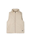 Παιδικό μπουφάν γιλέκο σε μπεζ χρώμα με φερμουάρ μπροστά και πλαϊνές τσέπες, ιδανικό για κομψές casual εμφανίσεις.
