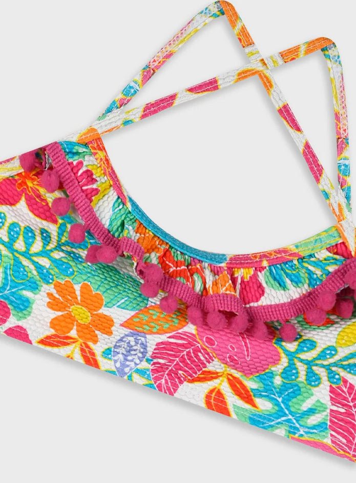 Crop top του παιδικού μαγιό μπικίνι Swimmy με πομ πομ και τροπικό μοτίβο

Πίσω όψη του σετ μαγιό μπικίνι Swimmy με χιαστί τιράντες και floral σλιπ

Παιδικό μαγιό μπικίνι Swimmy με πομ πομ και έντονα χρώματα

Κορίτσι φοράει το παιδικό μαγιό μπικίνι Swimmy στην παραλία